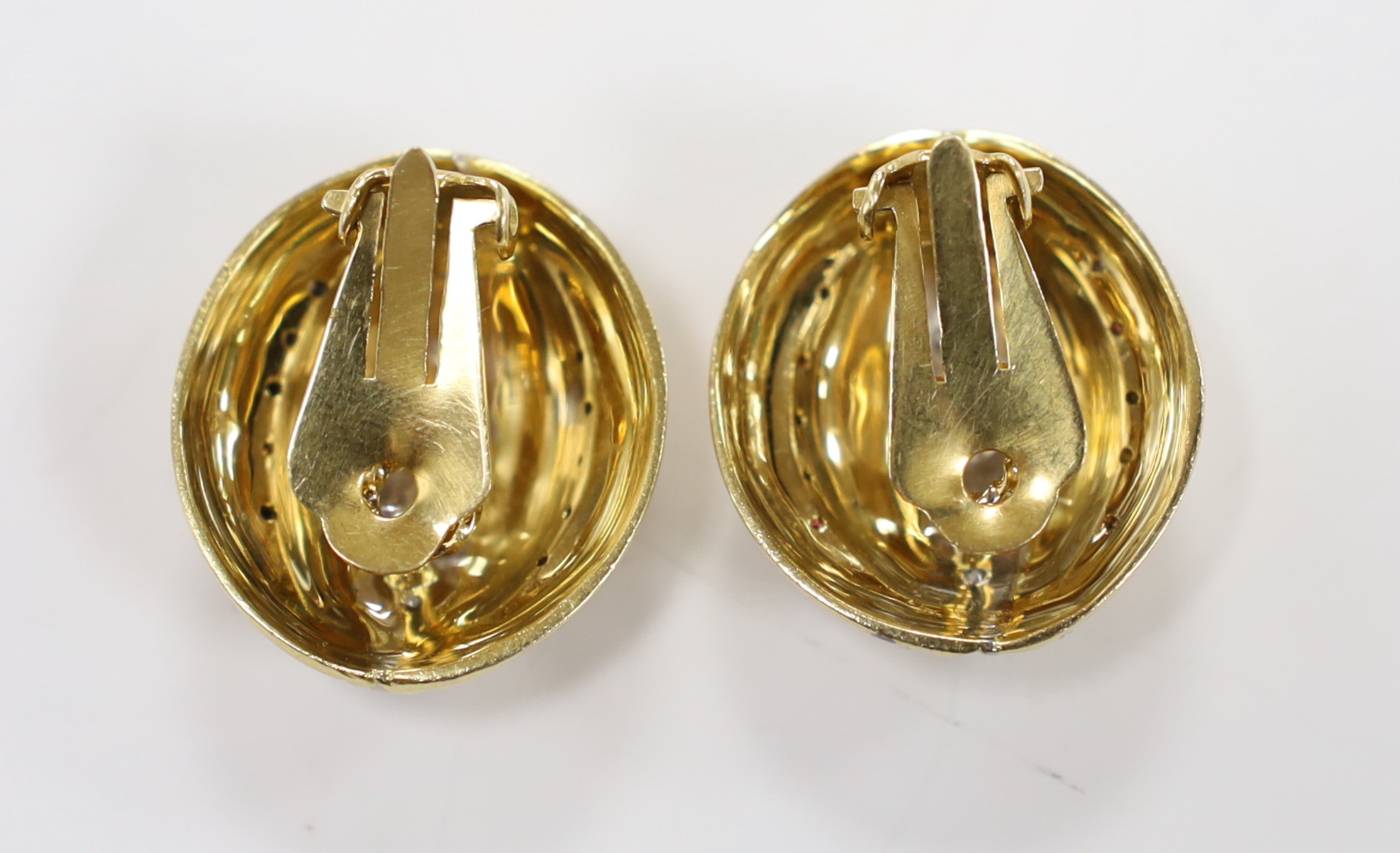 A pair of 18ct and diamond set three row line cluster fluted ear clips, 27mm, gross weight 26.7 grams.